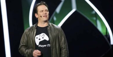 Phil Spencer speaking at an Xbox event, reassuring players about their game libraries and Game Pass.