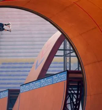 A skateboarder performing a trick in Tony Hawk’s Pro Skater game.
