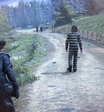 Hogwarts Legacy player stands near Azkaban prisoner NPC in dark prison cell