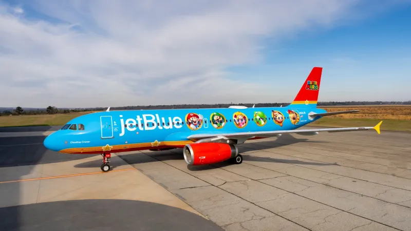 JetBlue airplane featuring Nintendo-themed artwork, celebrating the special crossover event.