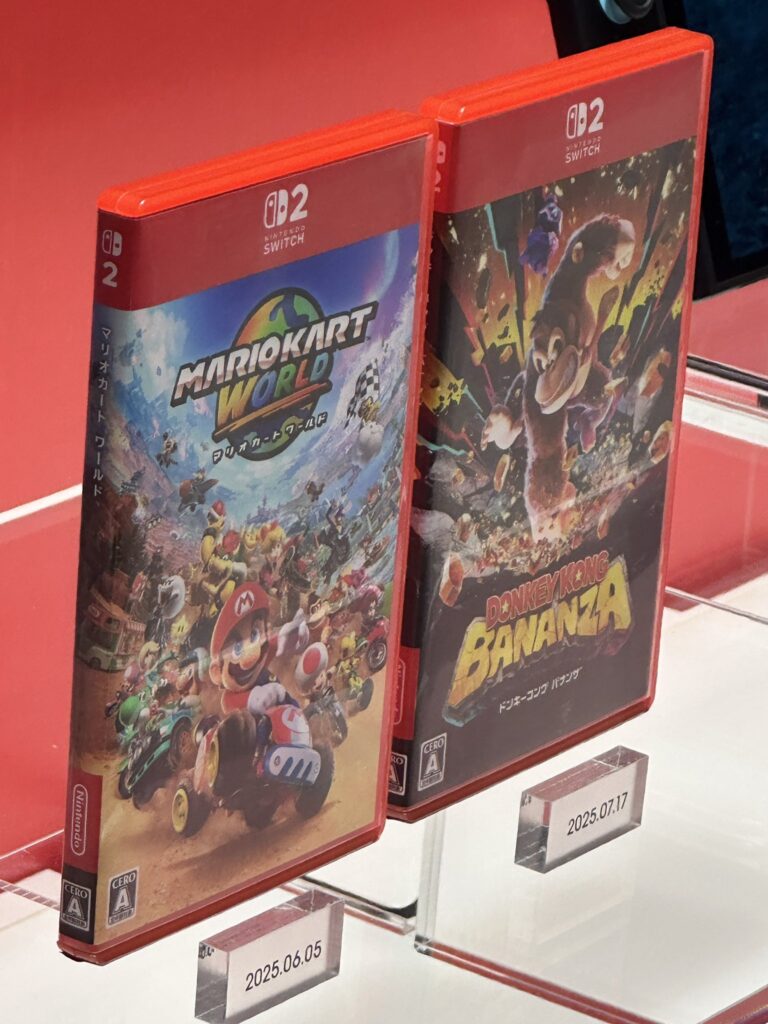 Nintendo Switch 2 game cases with new spine design compared to original red-spined cases.