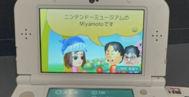 Visitors holding 3DS consoles at the Nintendo Museum in Kyoto, excited about StreetPass Miis featuring Shigeru Miyamoto