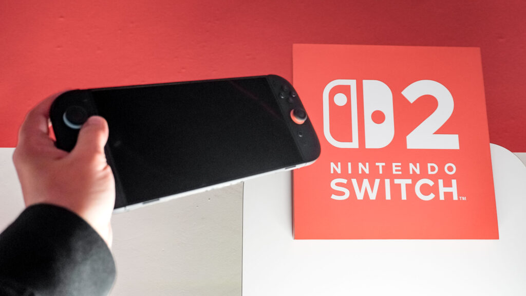 Nintendo Switch 2 console with price tag and tariff news overlay graphics