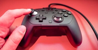 Nintendo Switch 2 Pro Controller with fast charging indicator beside original controller