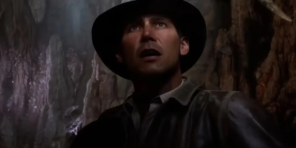 Frustrated gamers holding Indiana Jones and the Great Circle PS5 disc with error screen in background