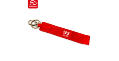 Red Nintendo Switch 2 wristlet keychain with logo, available through My Nintendo reward program