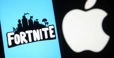 Tim Sweeney speaking at a tech event with Fortnite and Apple logos in the background.
