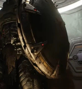 Doom: The Dark Ages gameplay showing Doom Slayer using the Shield Saw to leap across a gap