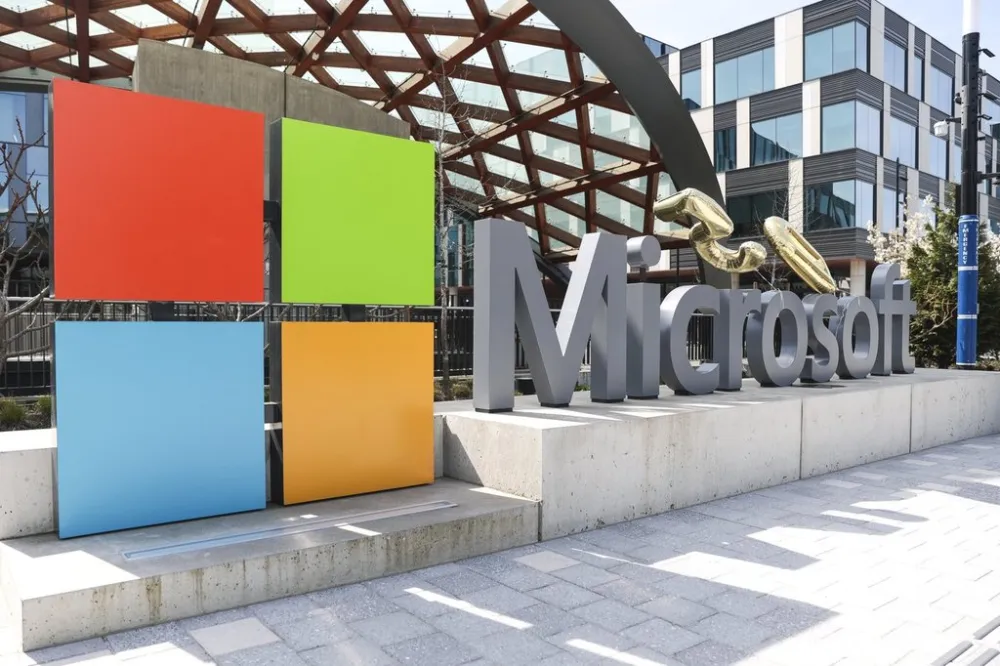 Microsoft logo outside headquarters amid 2025 layoffs