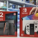 Nintendo Switch 2 packaging next to original Switch box in retail store
