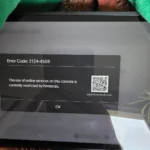 Nintendo Switch 2 console with red warning sign overlay indicating ban risk from secondhand purchases