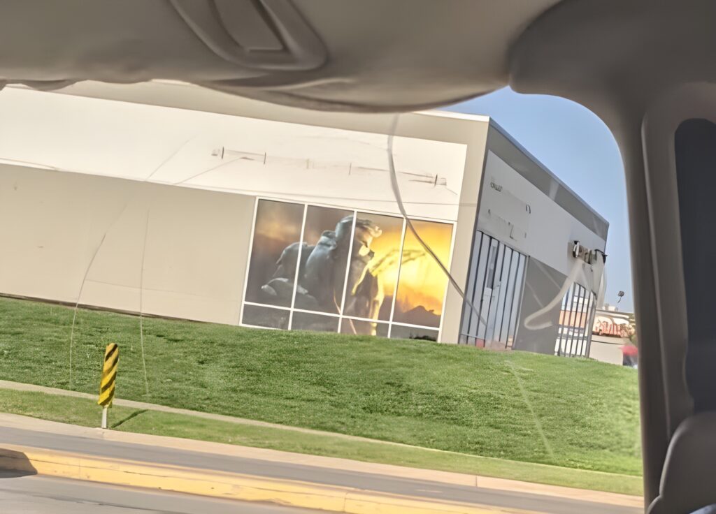 Large Master Chief poster in former GameStop window in Ames, Iowa