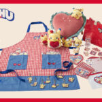 Pikachu Diner merchandise including plates and cups displayed at a Pokémon Center store
