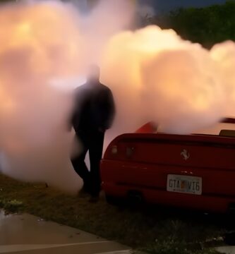 Travis Scott standing beside a car with GTA VI6 license plate in 2000 Excursion music video