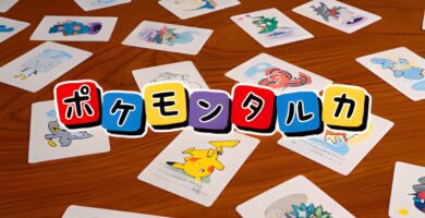 Cards from Pokémon Taruka featuring upside-down Pokémon illustrations during gameplay on a tatami mat.
