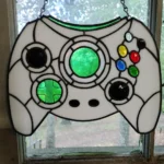 Stained glass artwork of Xbox's original Duke controller created by Reddit user Cellocalypsedown
