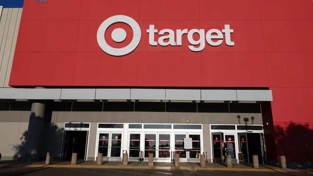 Target store signage with a “Price Match” sign being removed