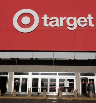 Target store signage with a “Price Match” sign being removed