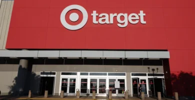 Target store signage with a “Price Match” sign being removed