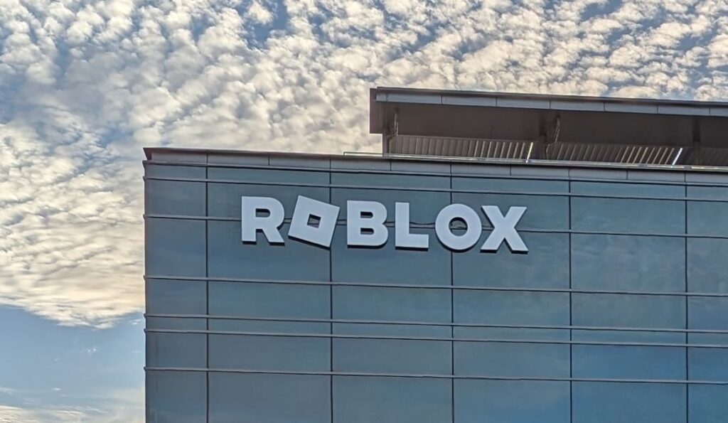 Roblox headquarters with legal scales overlay, symbolizing the company’s response to the Louisiana child safety lawsuit.
