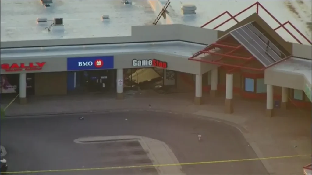 Damaged GameStop storefront after smash-and-grab robbery in Chicago