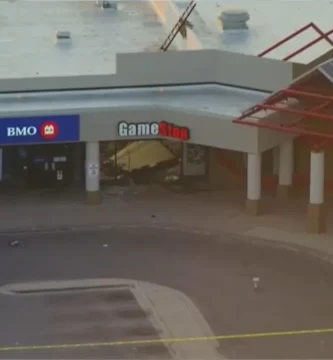 Damaged GameStop storefront after smash-and-grab robbery in Chicago