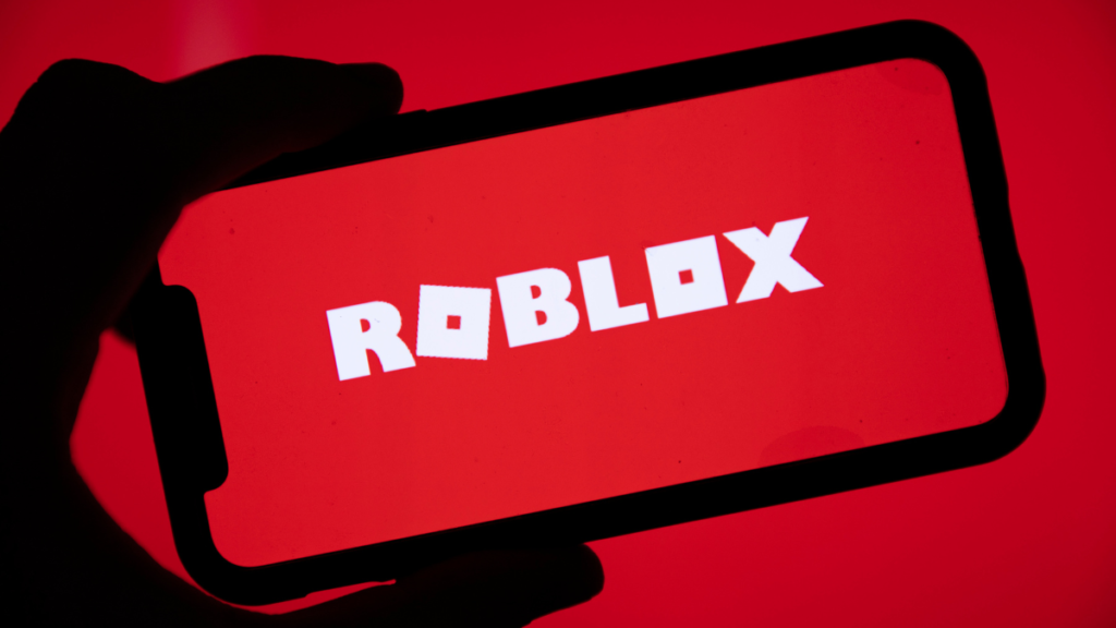Roblox logo with child safety alert and age restriction update