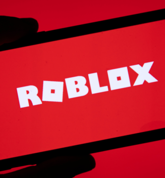 Roblox logo with child safety alert and age restriction update